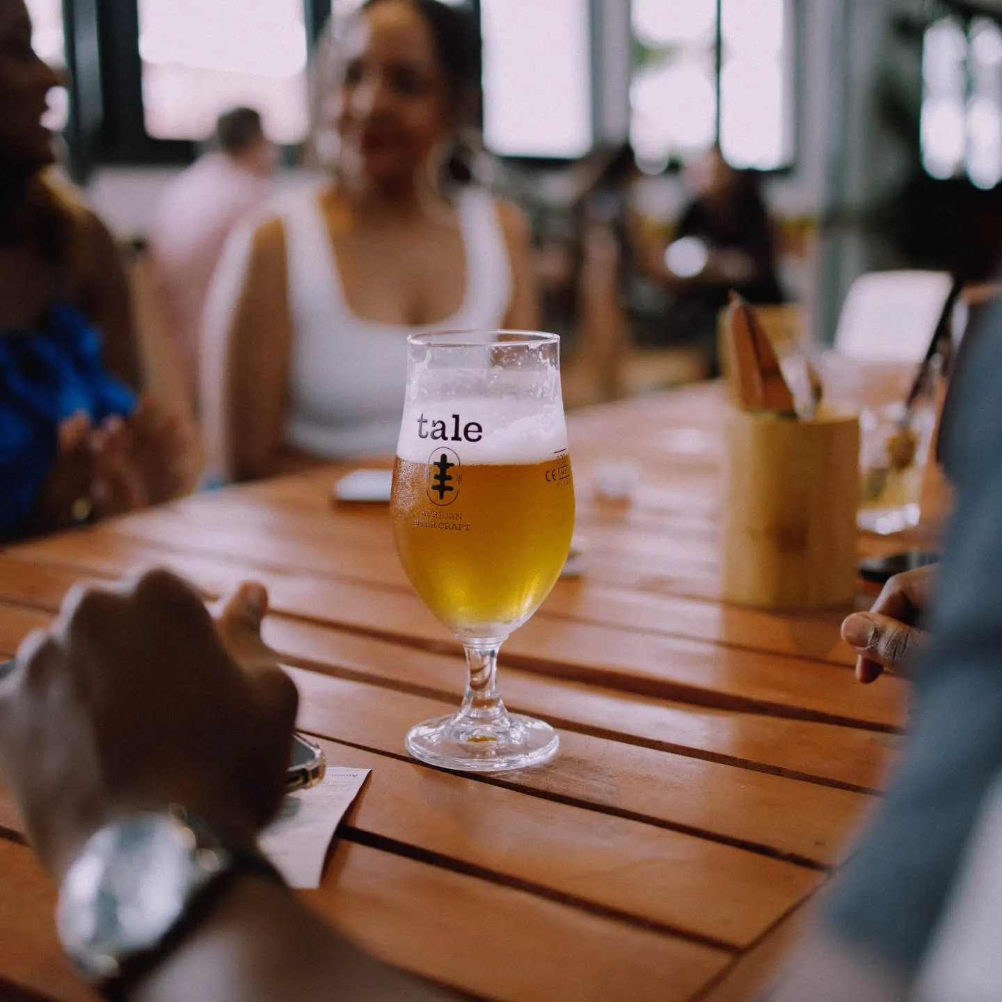 A glass of Tale lager on the garden table